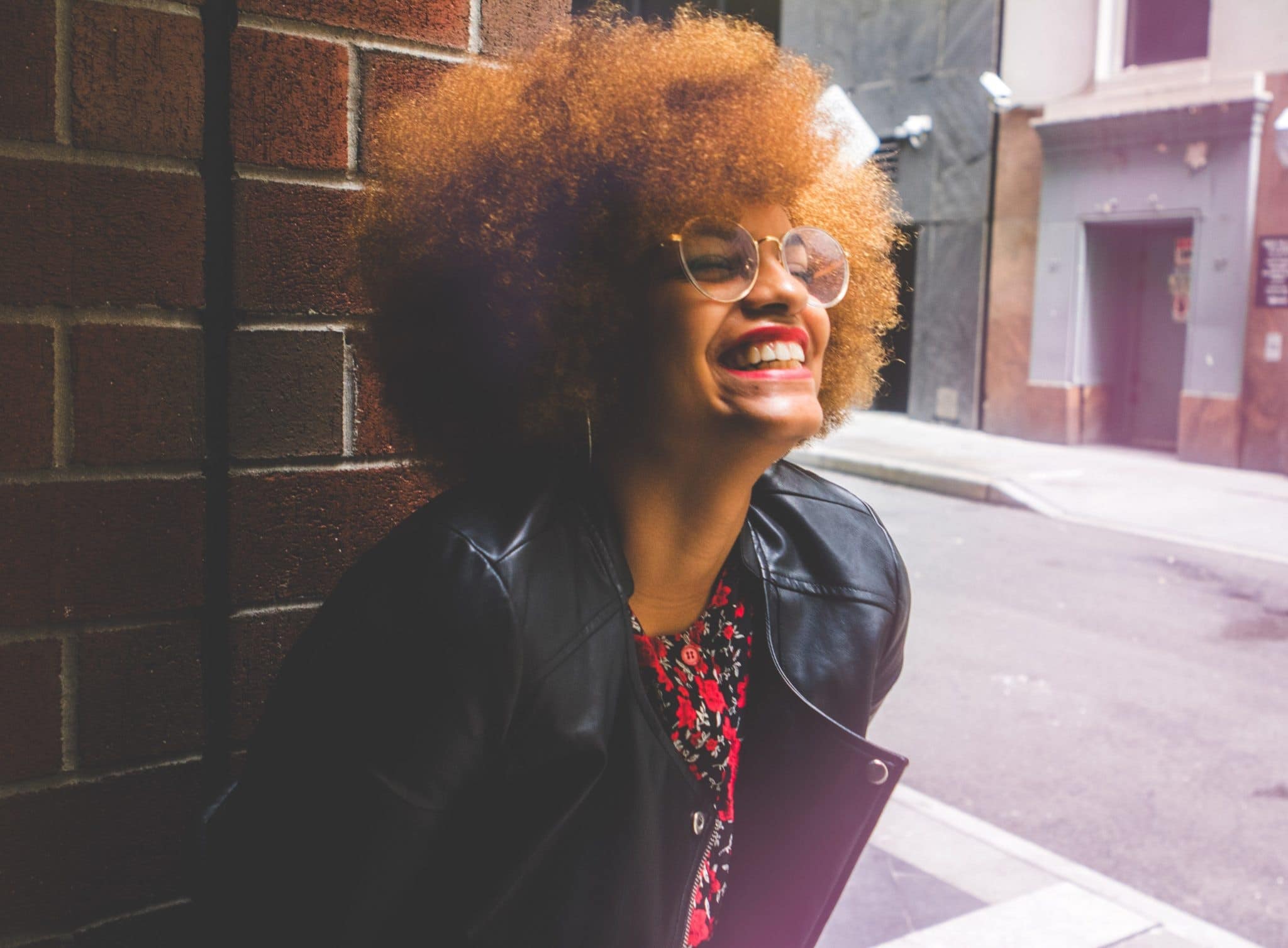 black woman with afro and leather jacket