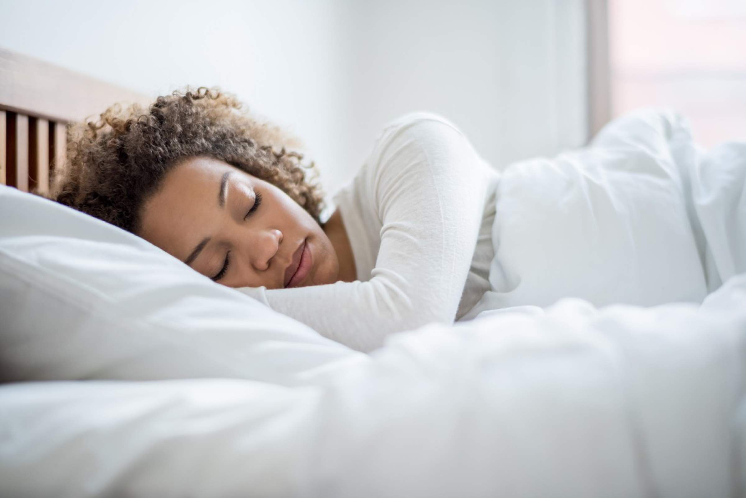 black woman asleep in bed