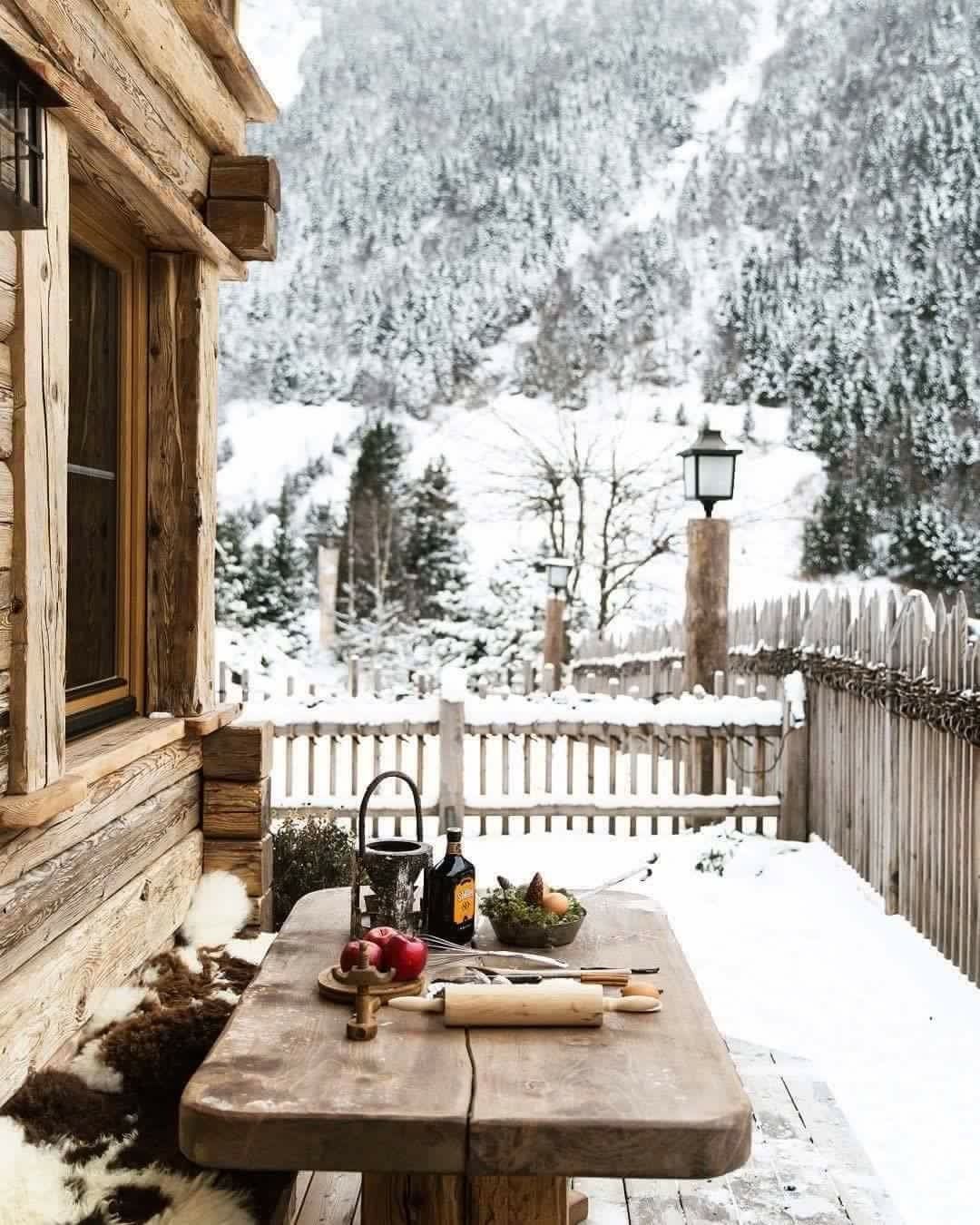 snow on a winter cabin house